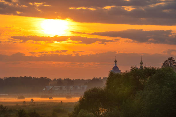summer evening, sunset in yellow, orange and pink with clouds, background