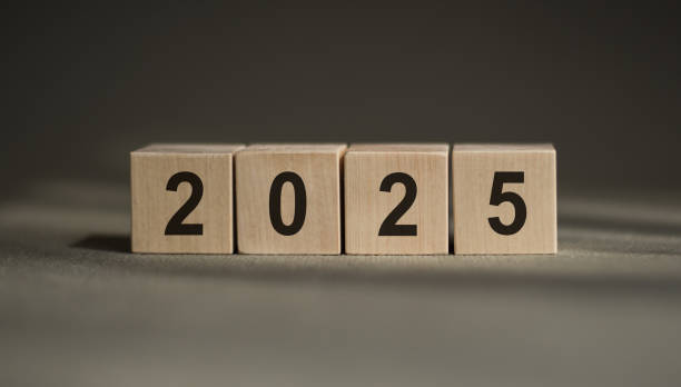 istock Wooden Blocks Displaying The New Year 2025 On A Gray Surface 2160558401