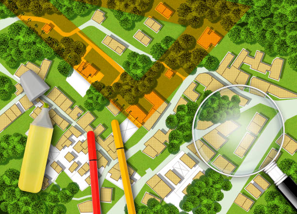 istock 3D rendering of colored work tool over a cadastral map of territory with buildings, fields and roads - concept image 2160561379