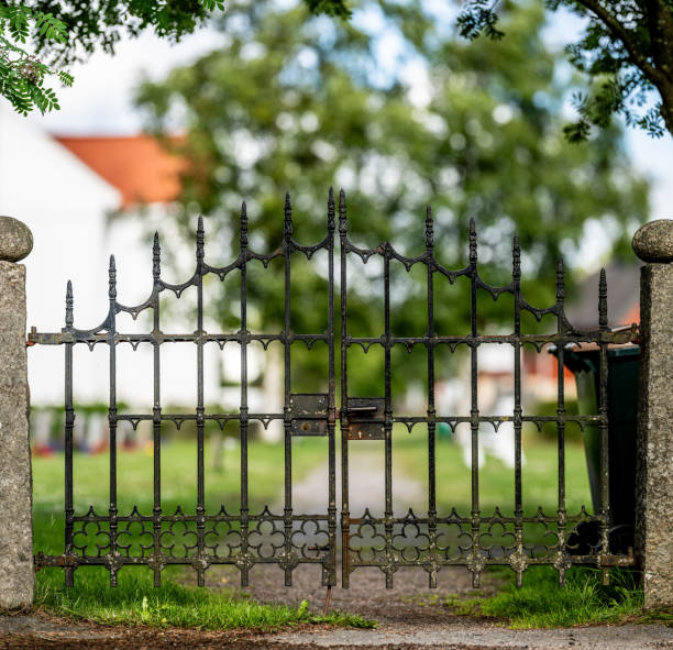 istock Metal gate to an old grave yard.. 2160561919