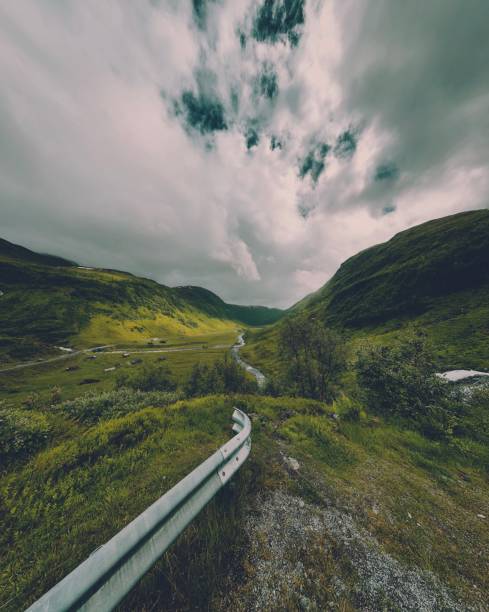 green mountain road, winding route along gorge in Norway
