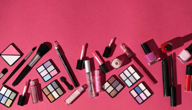 istock Various decorative cosmetics and brushes on a pink background, copy space for text 2160564047