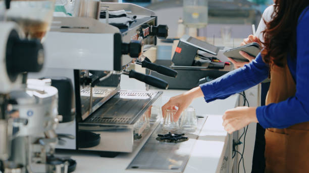 istock Barista Training New Employee on Espresso Machine 2160564425