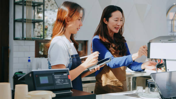 istock Barista Training New Employee on Espresso Machine 2160564426