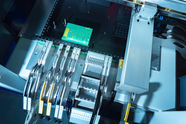 istock Machine for creating printed circuit boards. Equipment for creating PCB boards. Blank for a printed circuit board during assembly. Concept - PCB Assembly on modern equipment. Microboard development. 2160564547