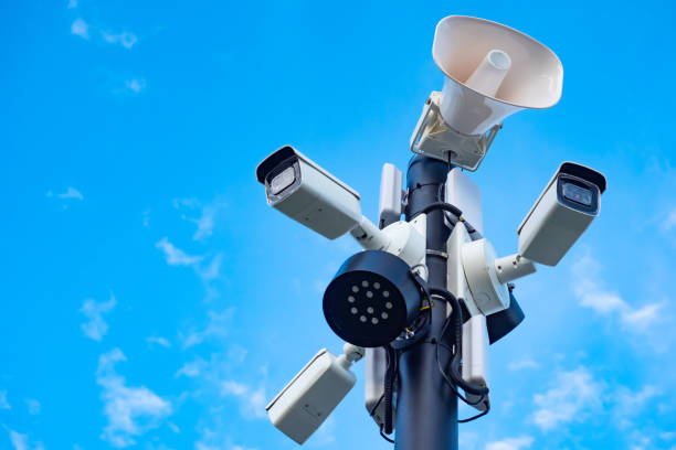 istock Street pole with multiple surveillance cameras. CCTV cameras on sky background. Security concept in city. Street video surveillance system. Purchase CCTV cameras. Safety equipment. 2160564585