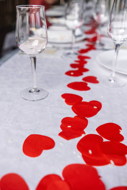 Still photography of colorful confetti and champagne glasses on the table