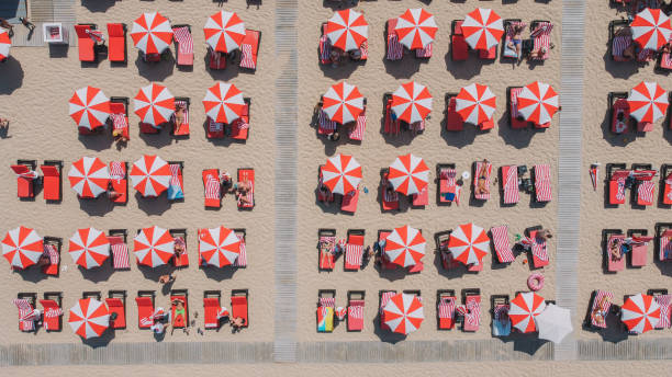 istock Red Umbrellas In the Beach Aerial 2160565332