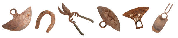 istock Multiple rusty garden tools, scissors, hoes and a horse shoe , collection isolated on white background banner 2160565364