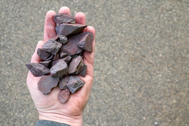 istock High grade (more than 63% Fe content) Australian iron ore, hematite (Fe2O3) held in hand. Blast furnaces feed for iron-making. 2160569826