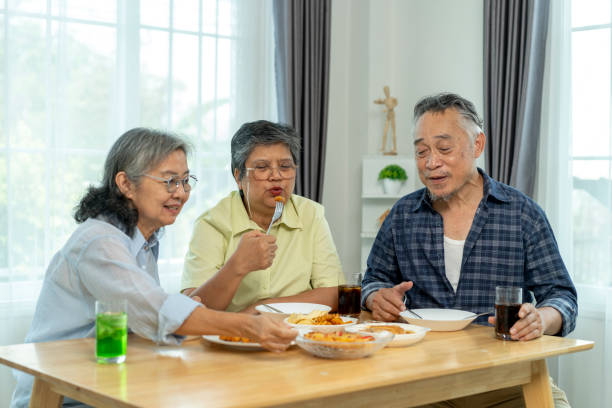 Three seniors sharing A Delectable Breakfast Spread with Freshly meal Delights