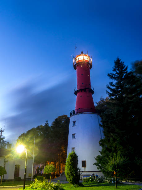 Old lighthouse on the Paldiski peninsula against a sky covered with clouds, close-up photo.