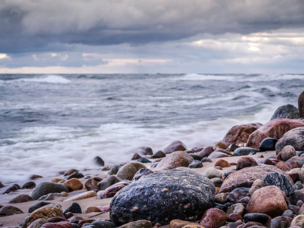 Rocky seashore with stormy sea waves