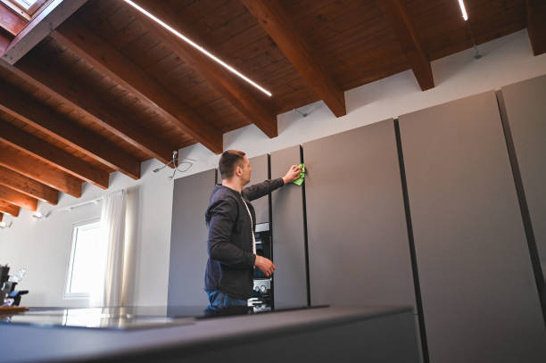 istock Young man cleaning own kitchen. 2160573502