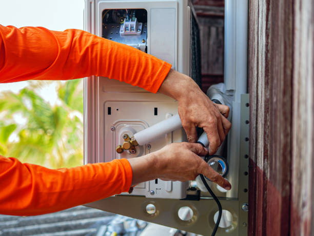 istock Air conditioning technicians install new compressor air in homes, Repairman fix air conditioning systems, Male technician service for repair and maintenance of air conditioners 2160574325