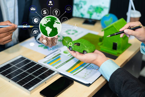 istock Businessman team brainstorming using tablet, laptop computer for working technology and business,  Renewable energy-based green businesses and global warming. Reduce CO2 emission. 2160574803