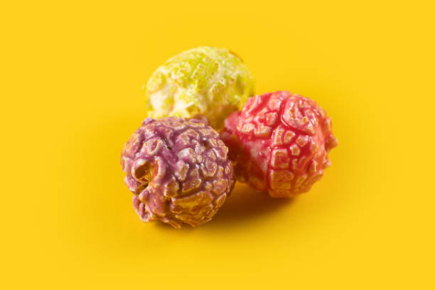 istock Colored fruity popcorn on yellow background 2160574853