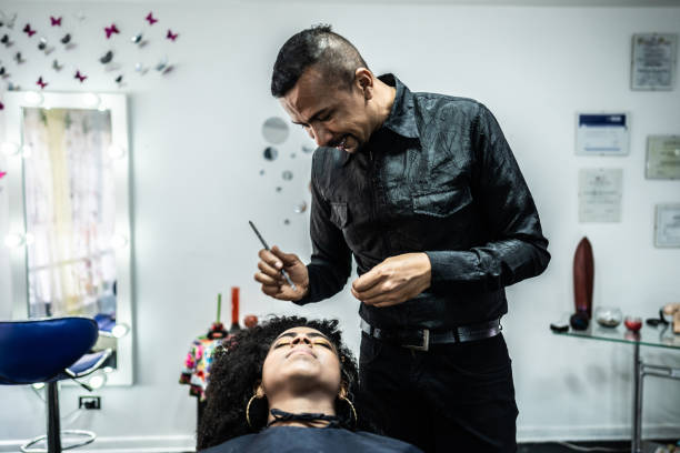 istock Beautician doing makeup on customer on beauty saloon 2160575381