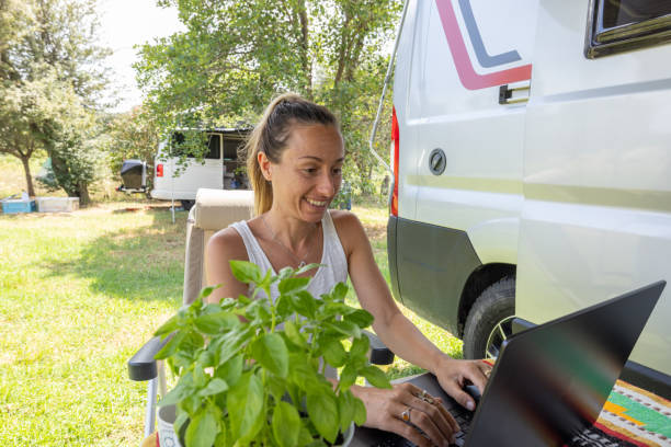 istock Digital Nomad: Woman at Campsite 2160581743