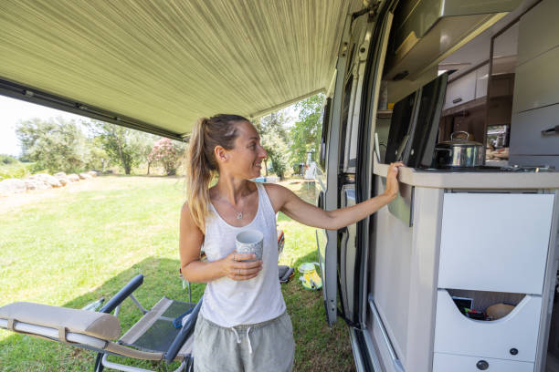 istock Woman Holding Coffee Mug by Campervan Kitchen 2160582151