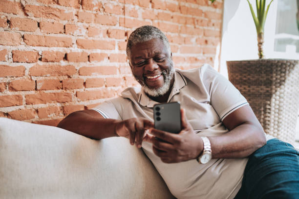 istock Portrait of an elderly man using smartphone at home 2160582569