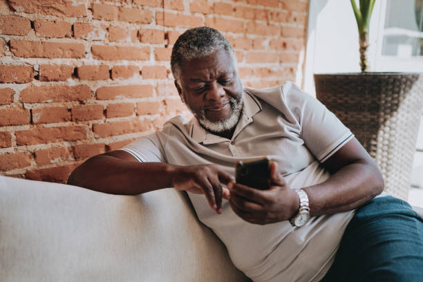 istock Portrait of an elderly man using smartphone at home 2160582572