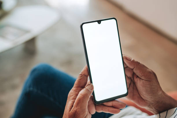 istock Senior woman using smart phone with blank white screen while relaxing 2160582587