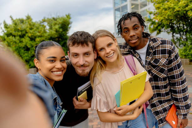 istock multiracial group of students taking a selfie photo 2160584190