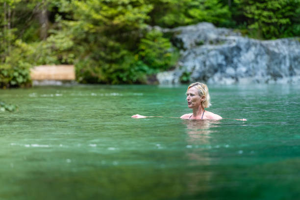 istock Woman in icy mountain water 2160584867