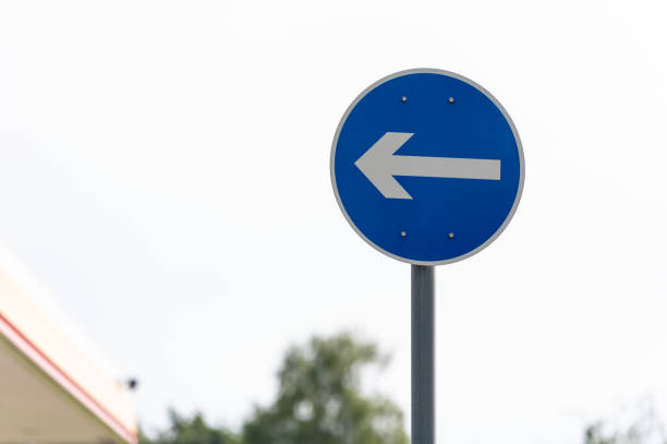 Direction to be followed traffic sign in summer.