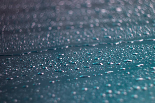 Raindrops on the window glass, water drops on the glass surface, raindrops on the window
