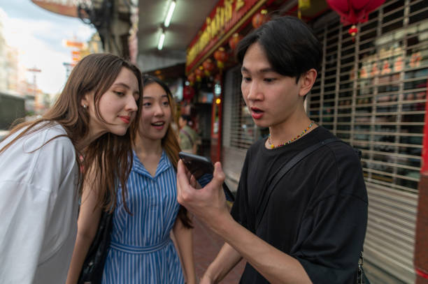 istock Generation Z interacting gadget tech on the street 2160585986