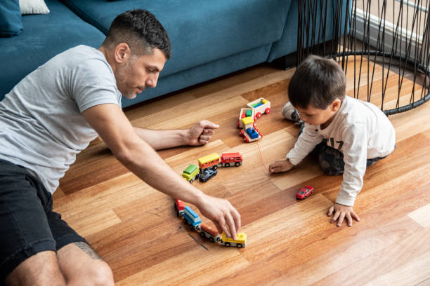 Father and son playing at home