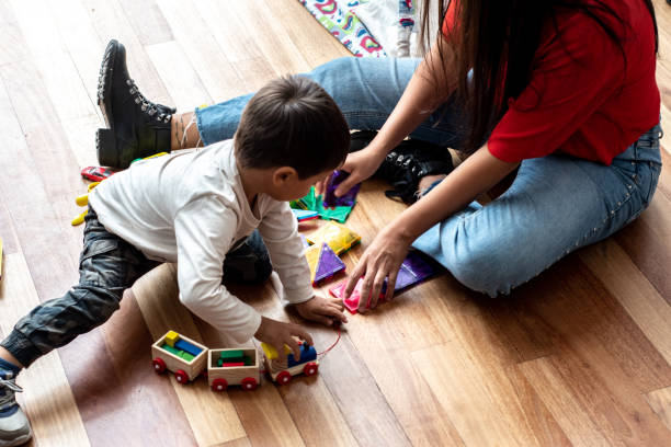 istock Mother and son playing at home 2160590561