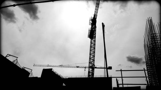istock Atmospheric Construction Cranes B&W Mood Photo 2160591140