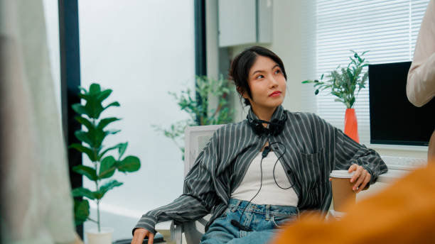istock Asian customer service agents having a meeting before starting their daily tasks. 2160591968