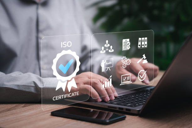 istock ISO, Certification and standardization management concept, Businessman use a laptop to show best standard checklist and conformity international standards and quality assurance of system and company 2160594127