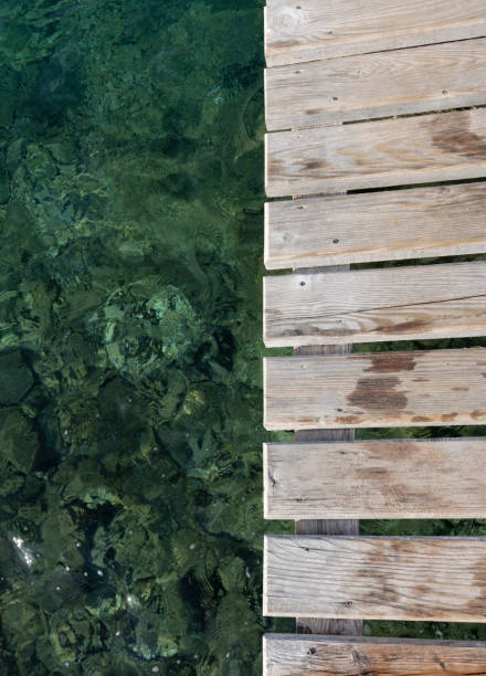 istock Wooden platform and sea water 2160595010