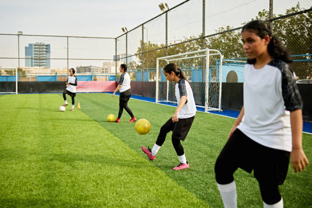 istock Teenage girls practicing ball control during team training 2160595039