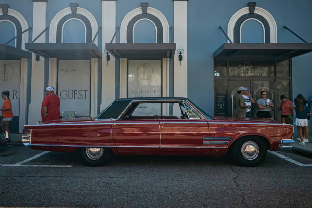 A vintage car and the MoMA Museum of Modern Art in Midtown Manhattan, New York City, USA