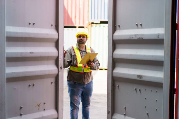istock Logistic supervisor is inspecting the incoming cargo container at container yard. 2160597117