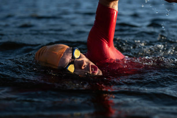 example of triathlete breathing after strokes in a lake
