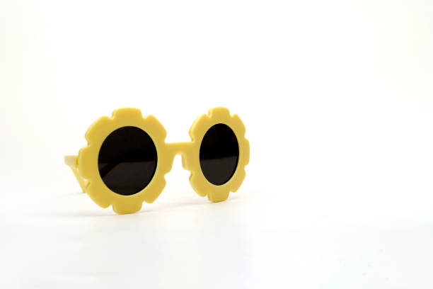 yellow flower-shaped sunglasses on a white background