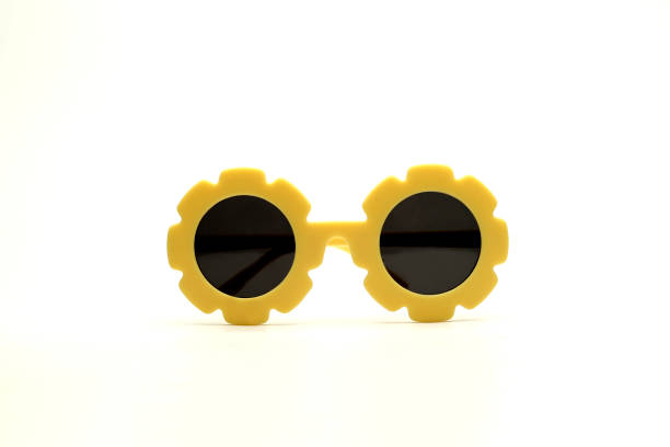 yellow flower-shaped sunglasses on a white background