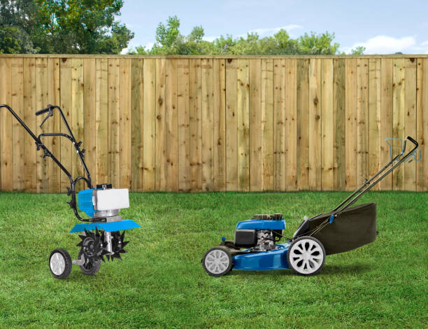 istock Portable garden tiller and a lawn mower in a backyard 2160597955