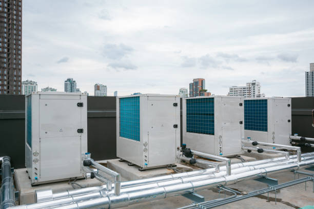 istock Air conditioner compressor installed in old building. Outdoor split wall type air conditioner compressor unit inverter installed on the outside of the building. Air conditioner compressor outdoor unit 2160600800