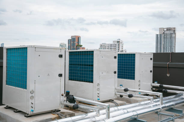 istock Air conditioner compressor installed in old building. Outdoor split wall type air conditioner compressor unit inverter installed on the outside of the building. Air conditioner compressor outdoor unit 2160600801