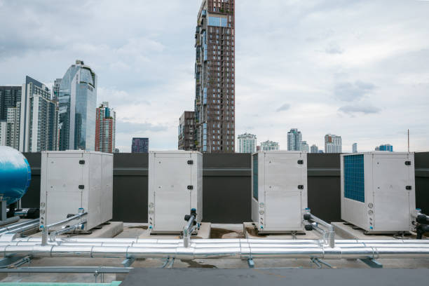 istock Air conditioner compressor installed in old building. Outdoor split wall type air conditioner compressor unit inverter installed on the outside of the building. Air conditioner compressor outdoor unit 2160600815