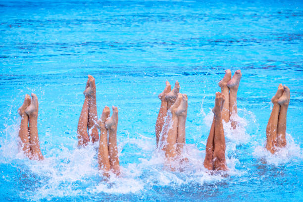 istock Artistic swimming team performing synchronized legs movement in swimming pool 2160602851