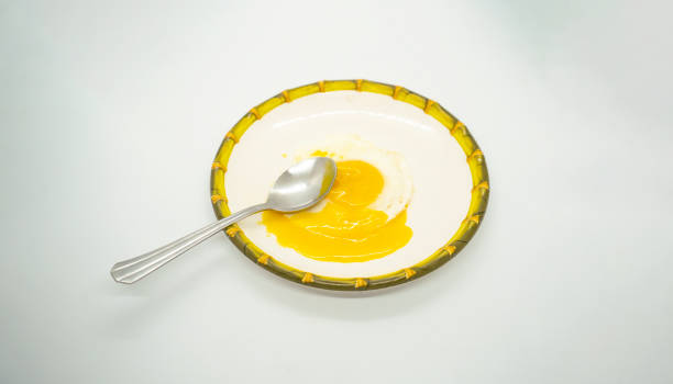 istock A fried poached egg with yellow poached egg on a plate ready to eat delicious 2160602880
